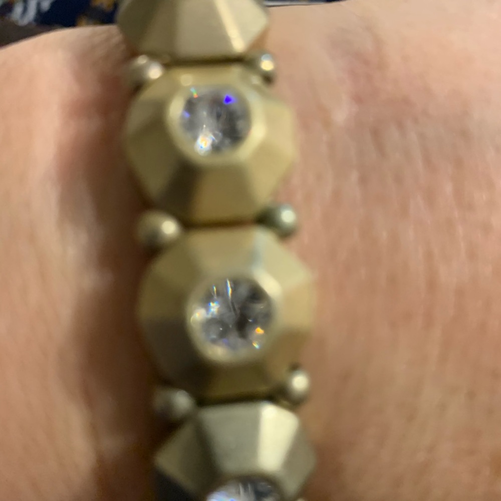Gold tone stretch bracelet with rhinestones